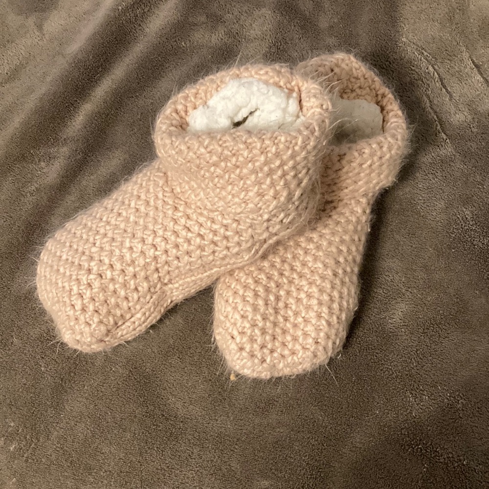 Pink knitted house slippers